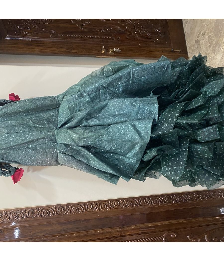 A BOTTLE GREEN GOWN WITH BEAUTIFUL FLOWERS