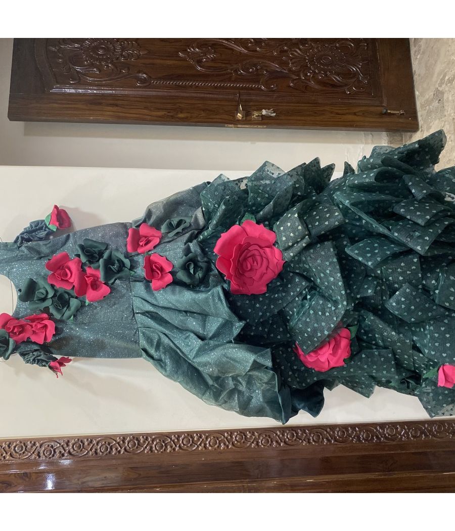 A BOTTLE GREEN GOWN WITH BEAUTIFUL FLOWERS